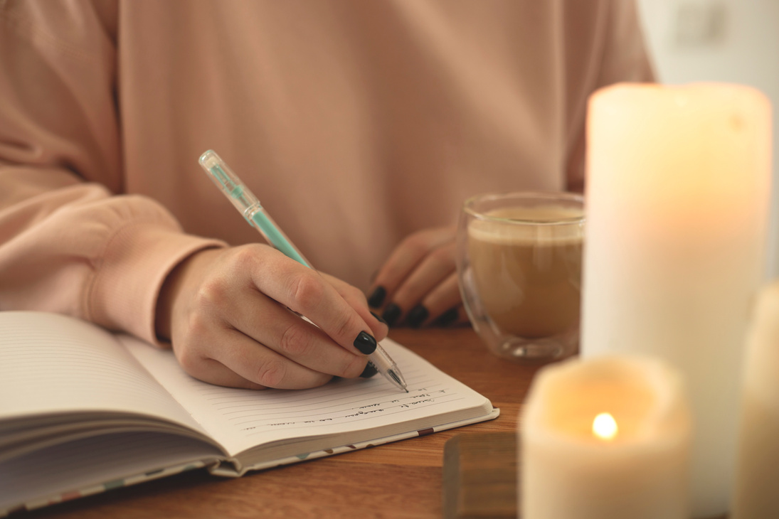 Woman Writing on Journal